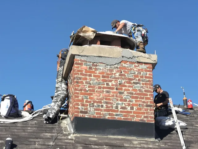 Yorba Linda Chimney Sweep installing a custom chimney crown in Yorba Linda, CA